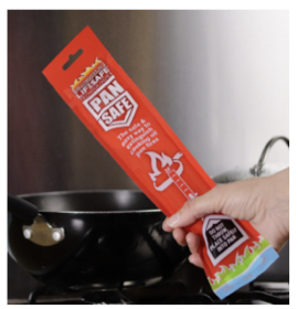 PanSafe fire suppression system being used on cooking pan